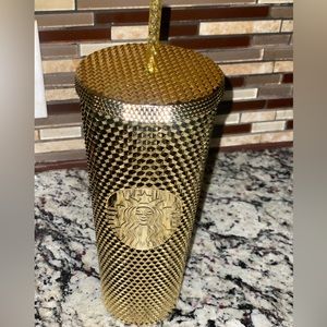 Gold studded Starbucks cup